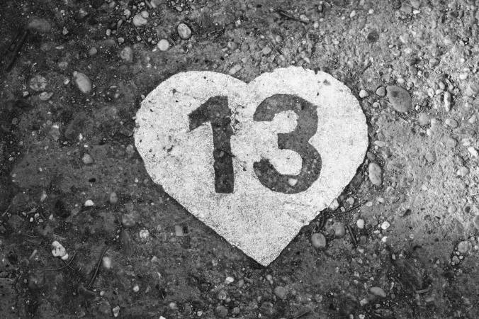 number 13 in a heart on gravel